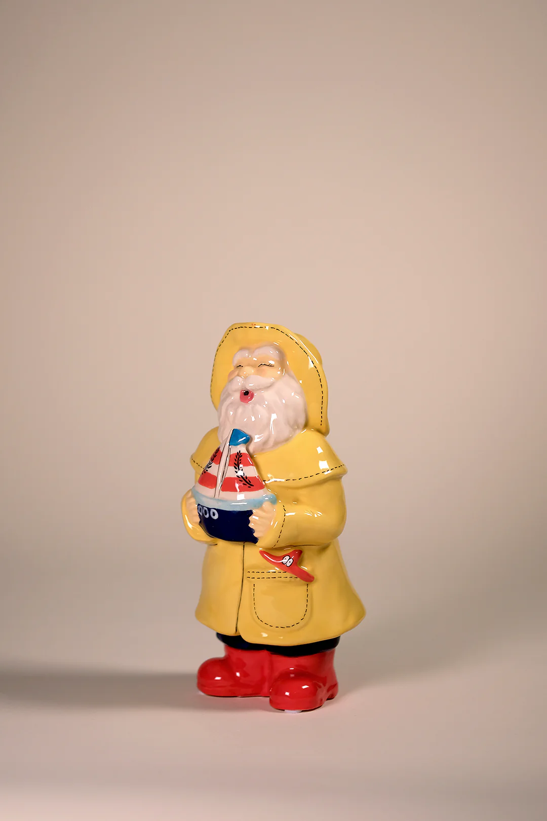 Man Holds the Sailboat Figurine - Image 3