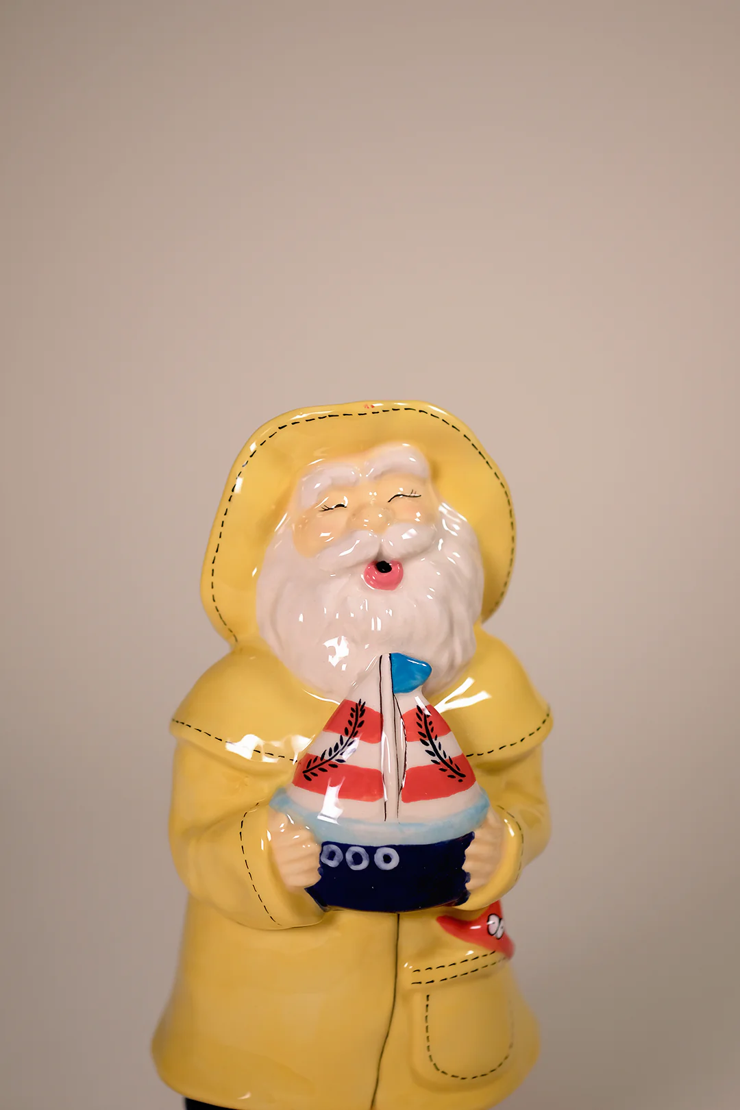 Man Holds the Sailboat Figurine - Image 6