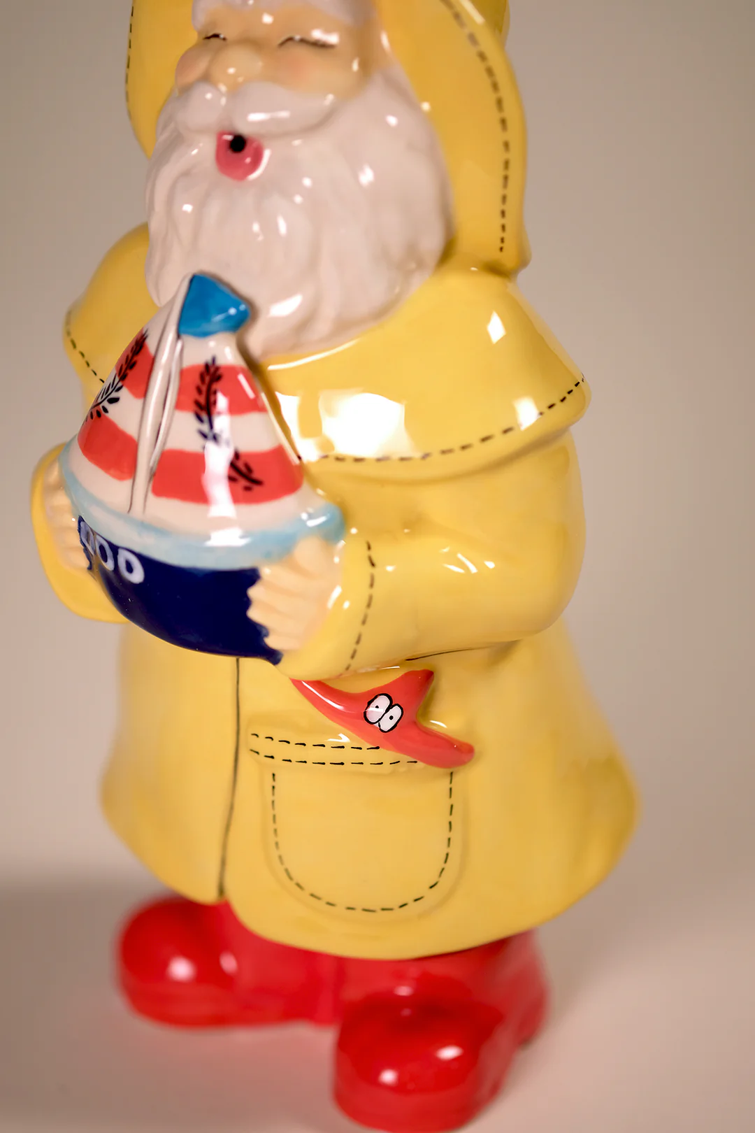 Man Holds the Sailboat Figurine - Image 7